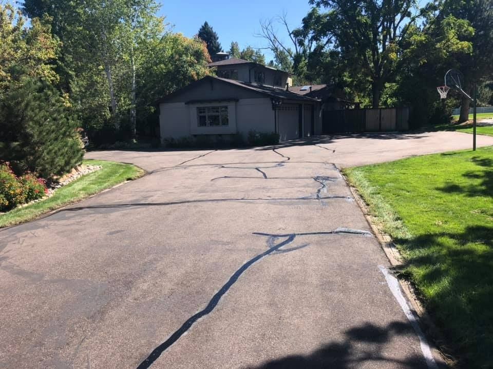 A driveway leading to a house in a residential area