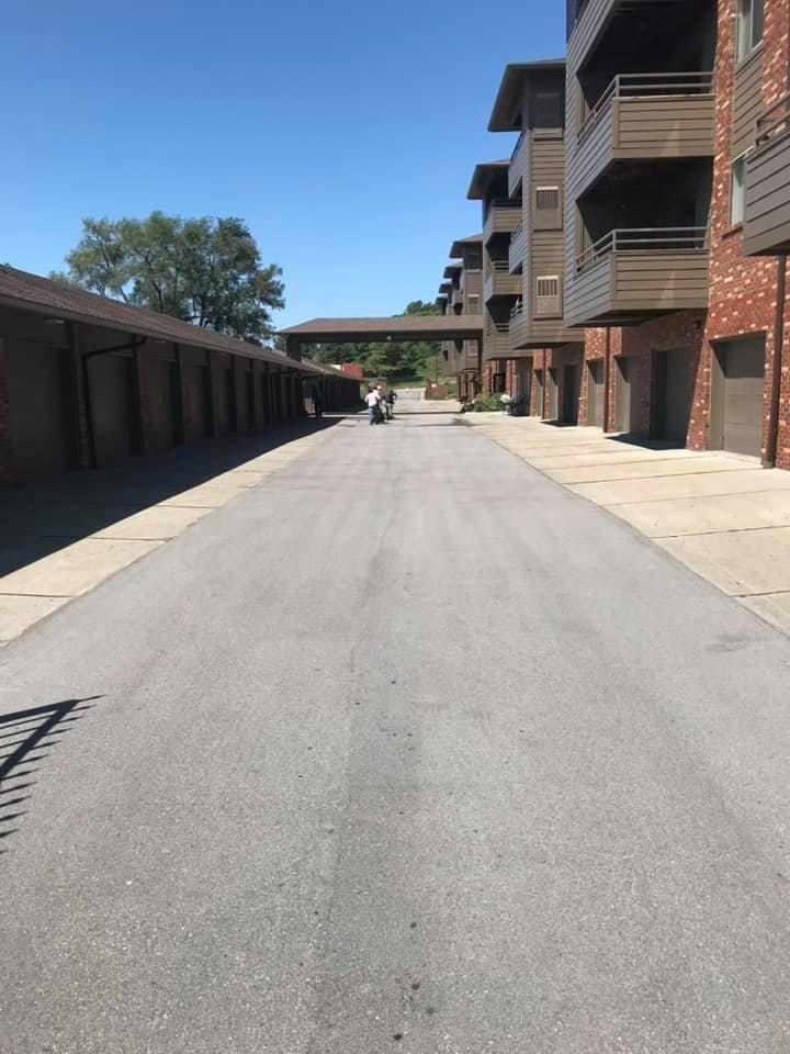 A row of apartment buildings along a road