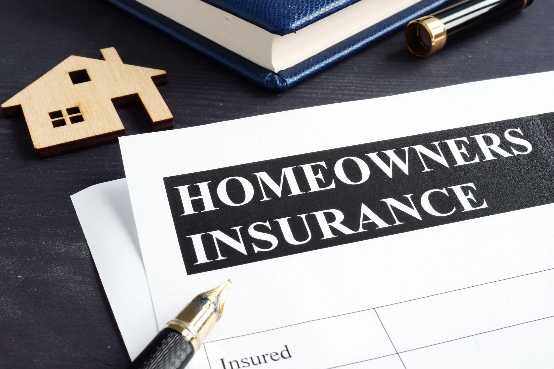 homeowners insurance documentation on a desk