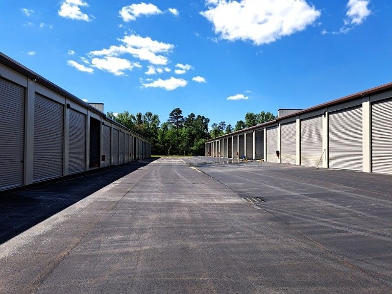 A row of storage units with a blue sky in the background