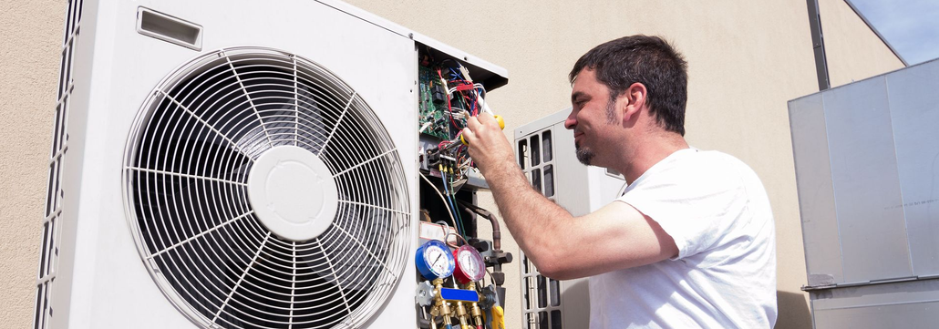 Stainless steel freezer with open door, revealing shelves and frosted interior.