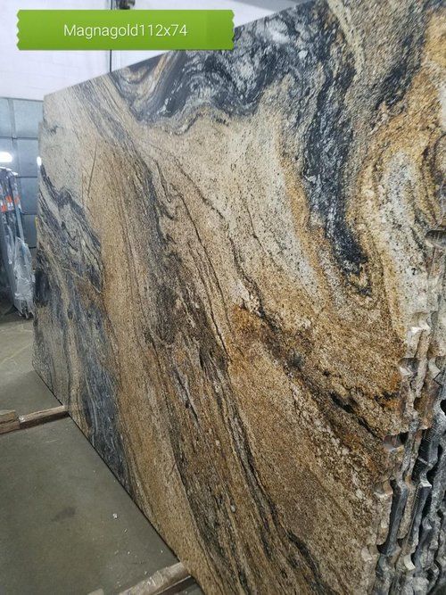 A large slab of granite is sitting on a wooden shelf.