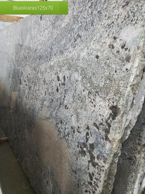 A stack of granite slabs sitting on top of each other.