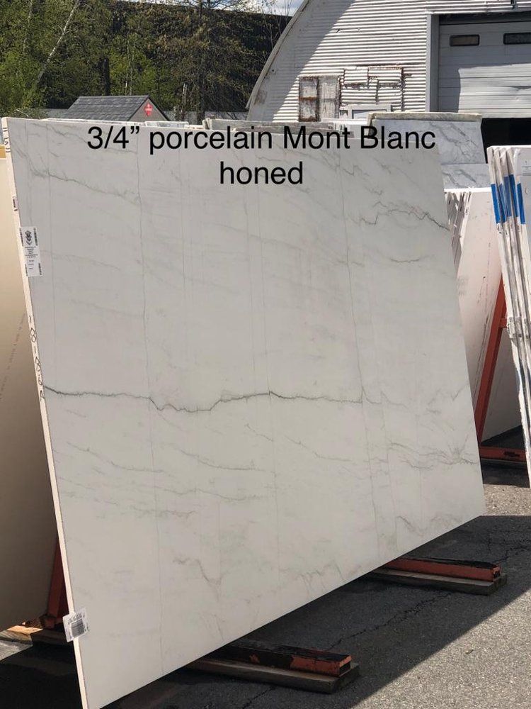 A large white slab of porcelain mont blanc is sitting on a pallet.