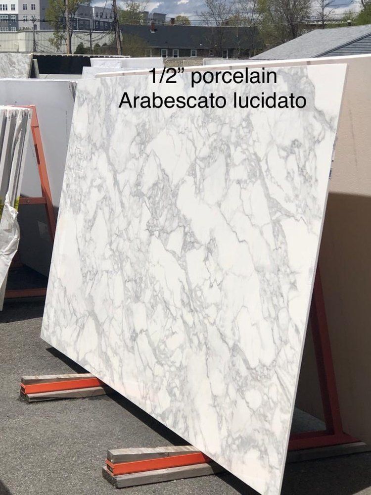 A large white marble slab is sitting on a stand.