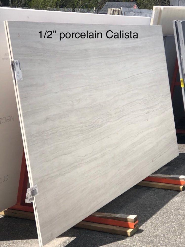 A large slab of porcelain calista is sitting on a rack.