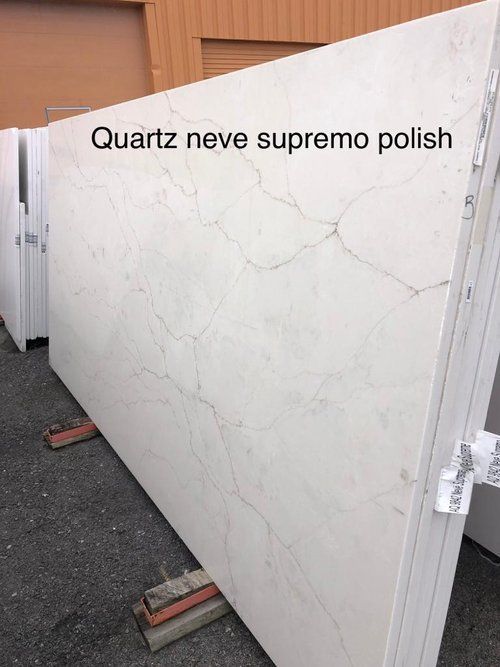 A large white slab of quartz neve supremo polish