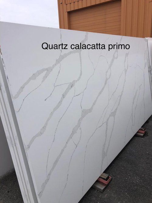 A large white slab of quartz calacatta primo