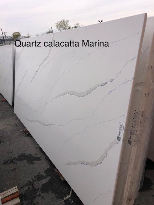A large white slab of quartz calacatta marina