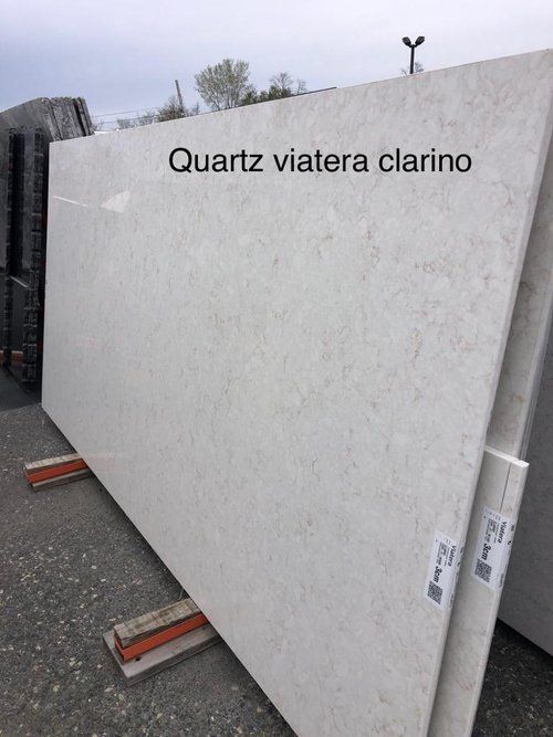 A large white slab of quartz is sitting on a pallet.