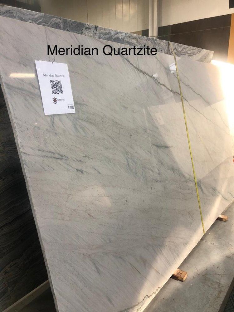 A large slab of meridian quartzite is sitting in a warehouse.