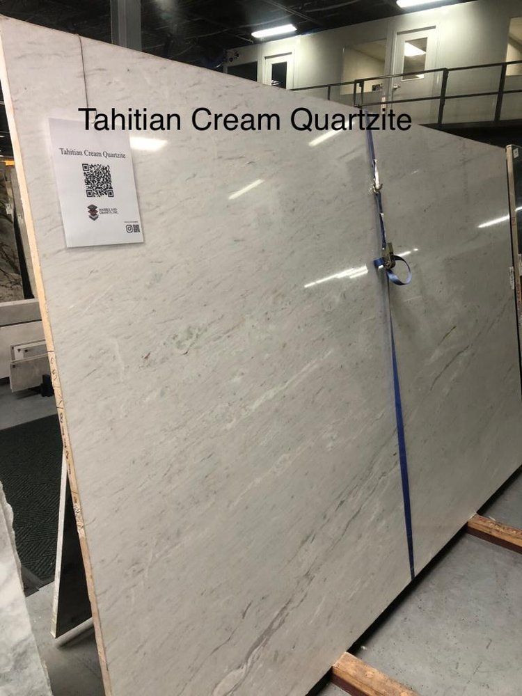 A large slab of olympia quartzite is sitting in a warehouse.