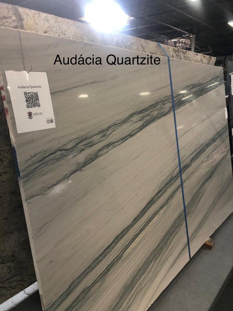 A large slab of quartz is sitting in a warehouse.