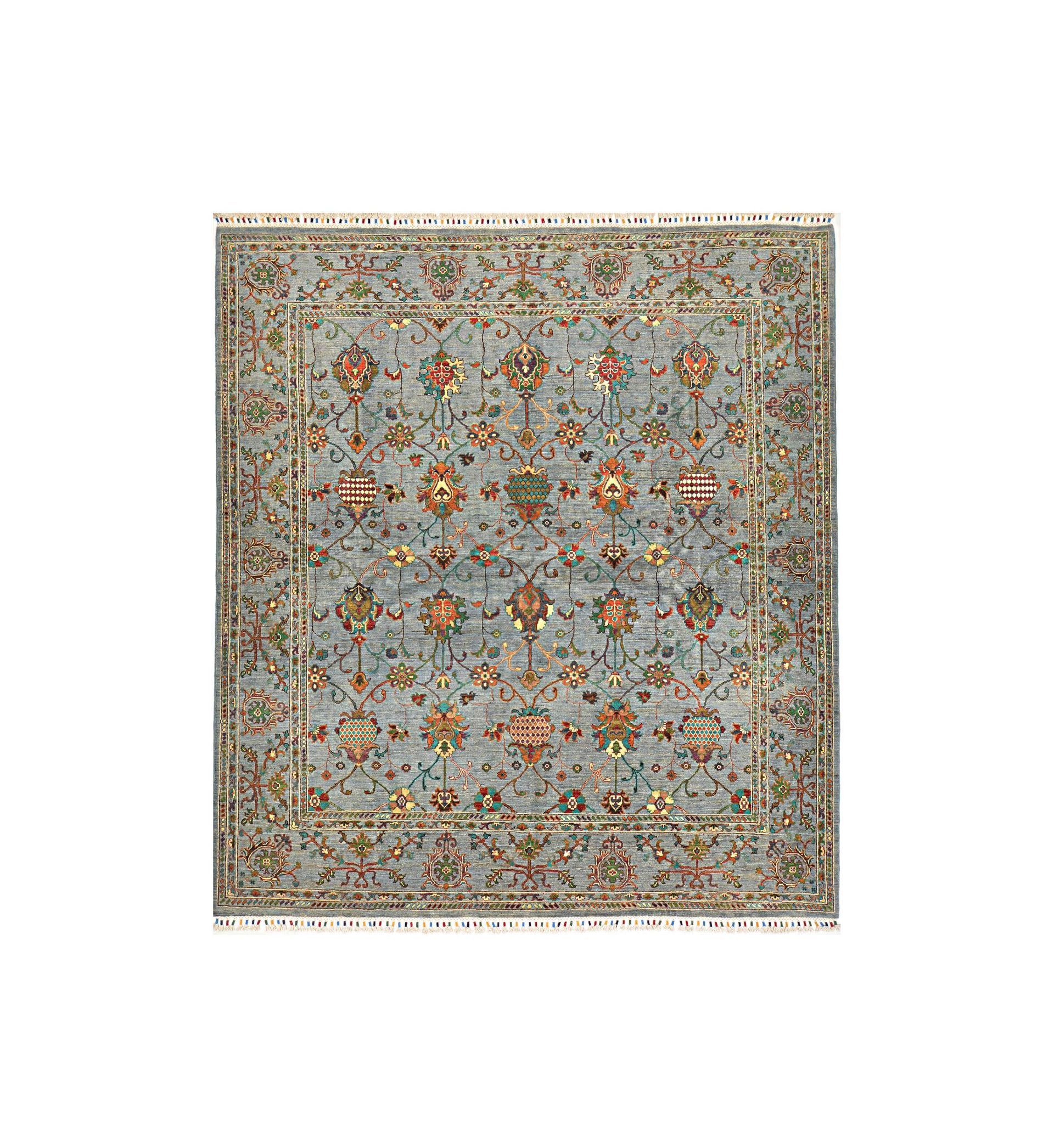 Ornate beige and blue floral rug with symmetrical pattern and decorative border
