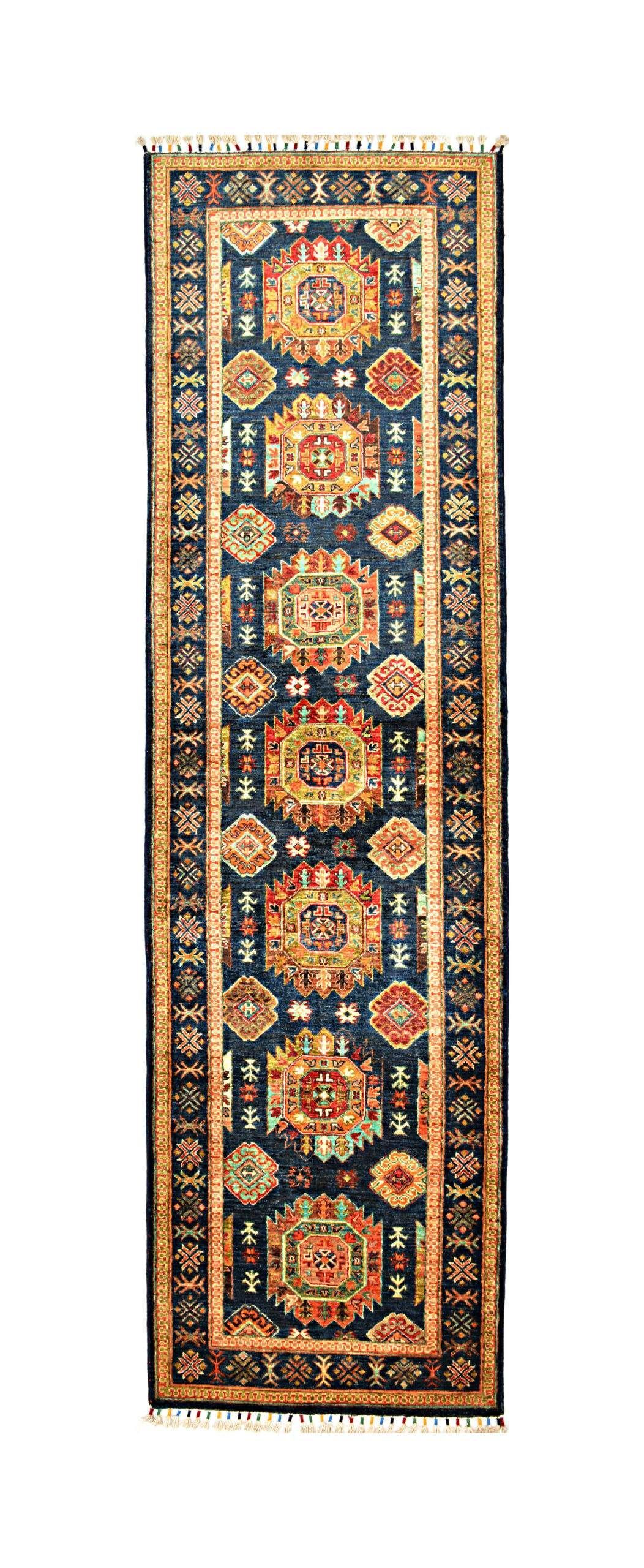 Long narrow patterned rug with geometric floral motifs in orange, blue, and cream on a dark border