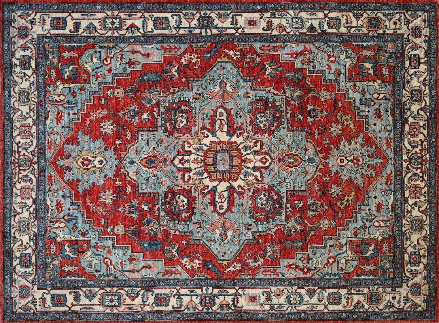 Red and blue ornate patterned area rug with a central medallion and floral border.