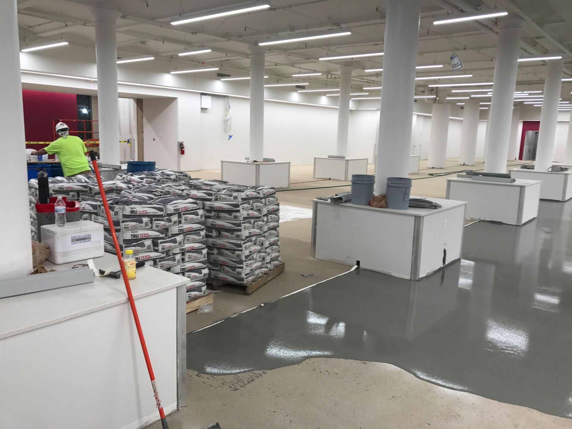 Self leveling concrete flooring