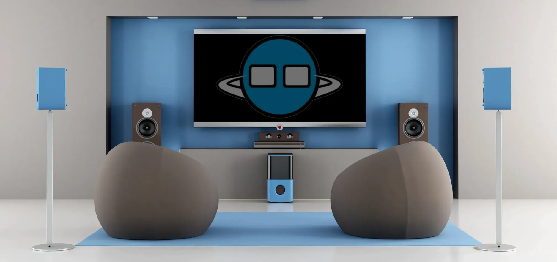 Living room with a large TV featuring a logo. Two bean bag chairs face the screen, with speakers and a sound system.