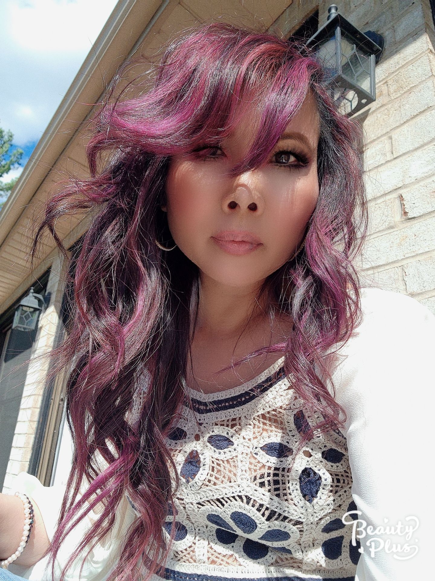 a woman with long purple hair