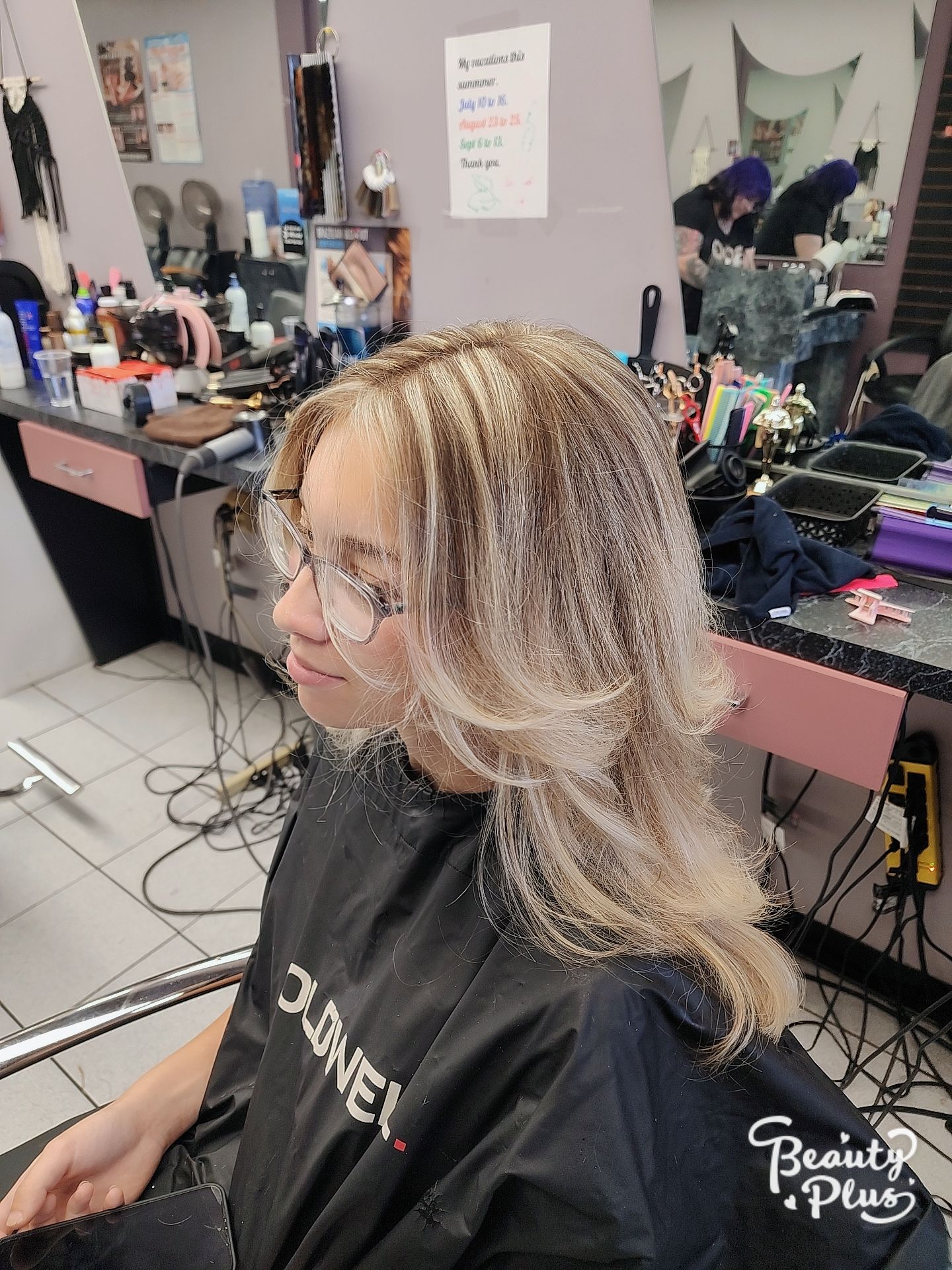 a woman is getting her hair done in a salon