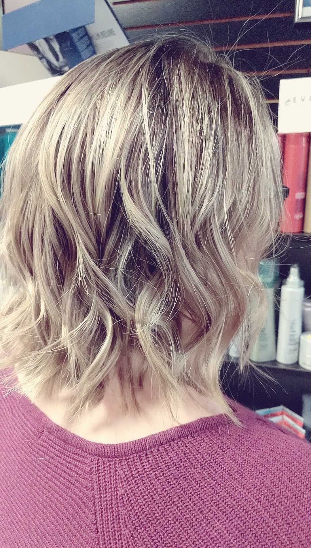 a woman with short blonde hair with highlights