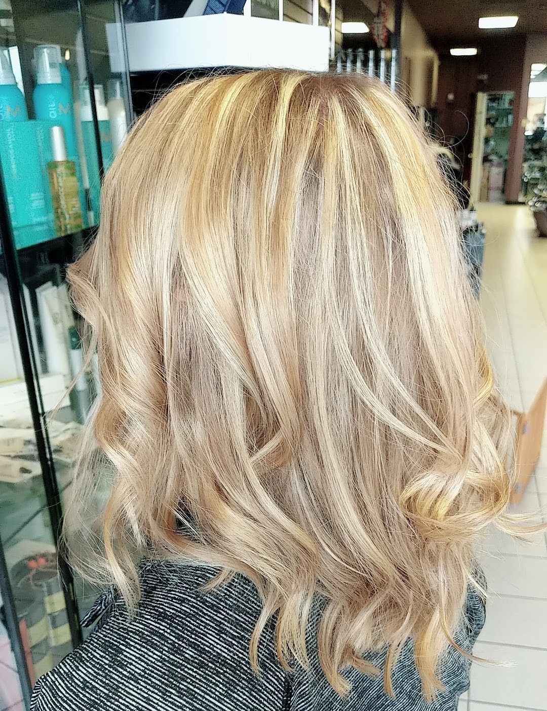 a woman with blonde hair with highlights
