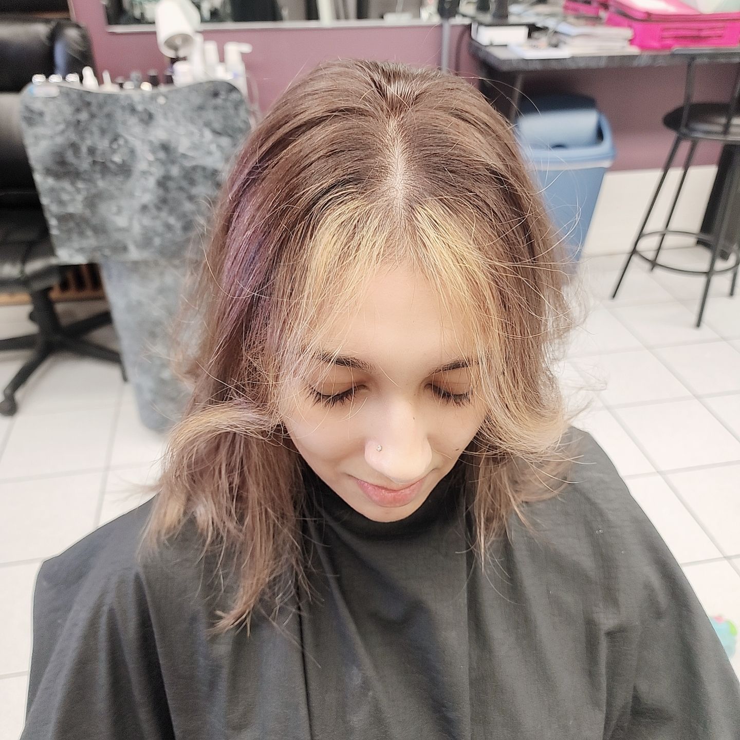 a woman with hair highlights