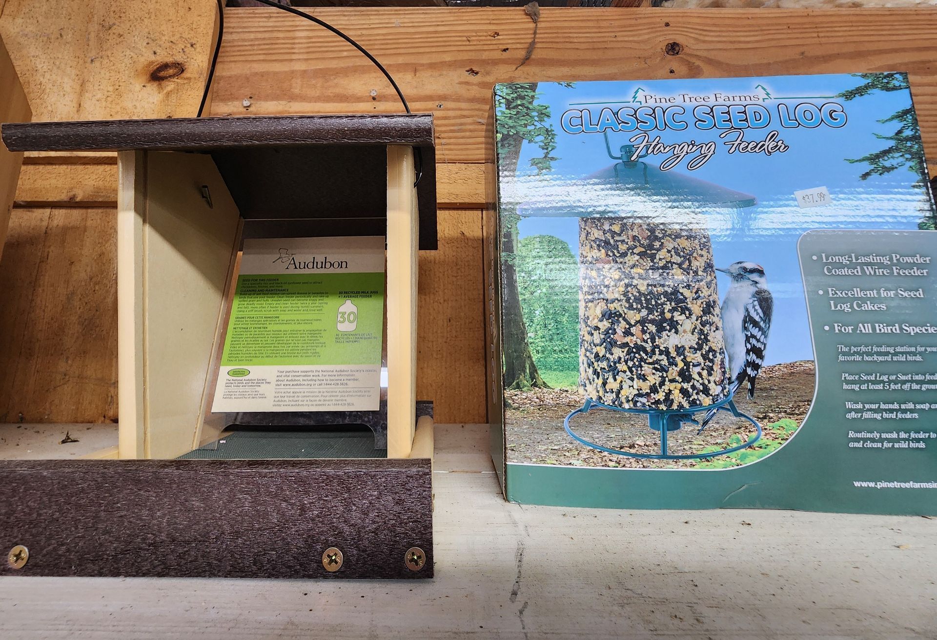Wooden display case beside a colorful informational sign about a scenic coastal site
