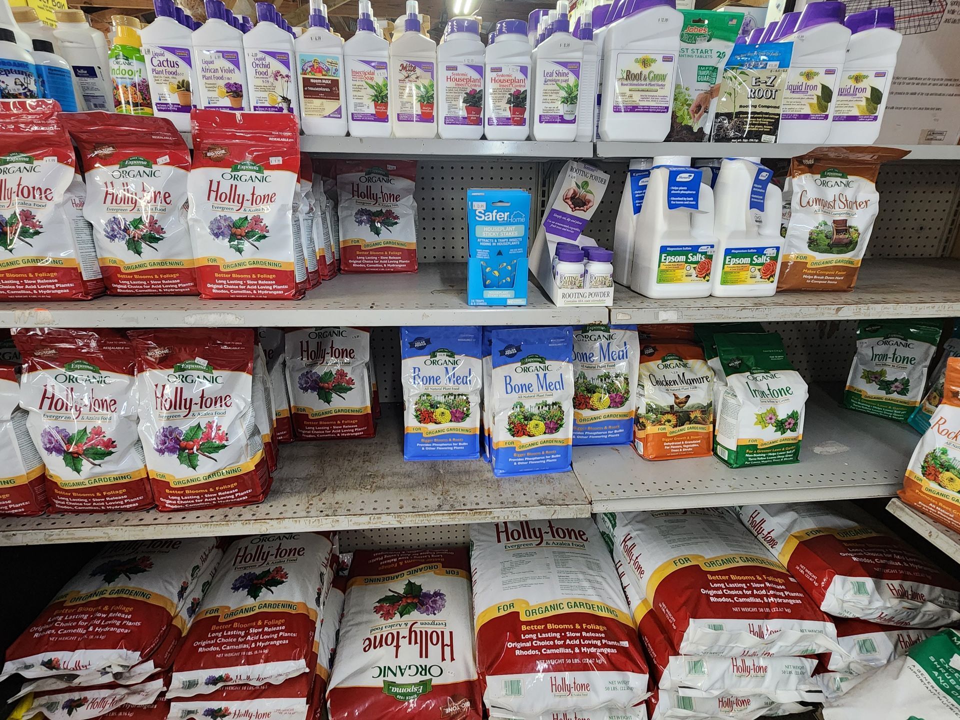 Shelves of packaged pet food bags and cartons in a store aisle