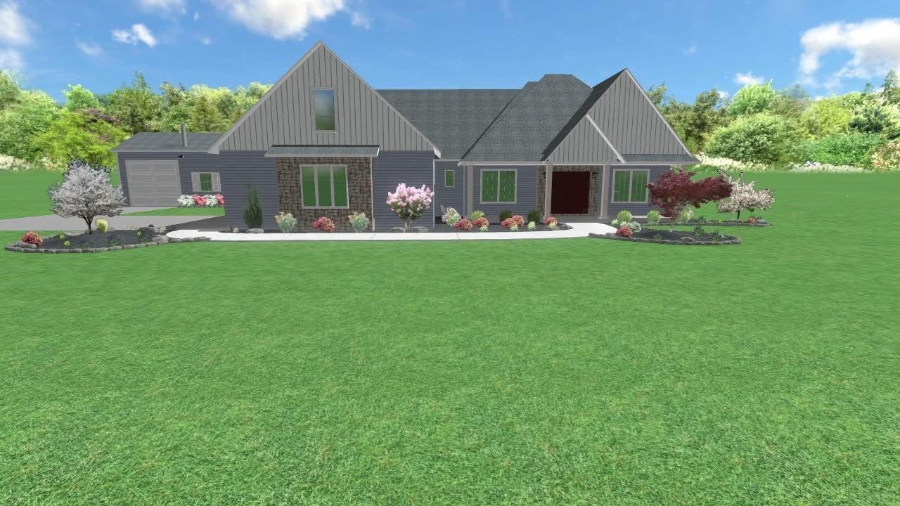 Blue house with stone accents, gray roof, and green lawn under a sunny sky.