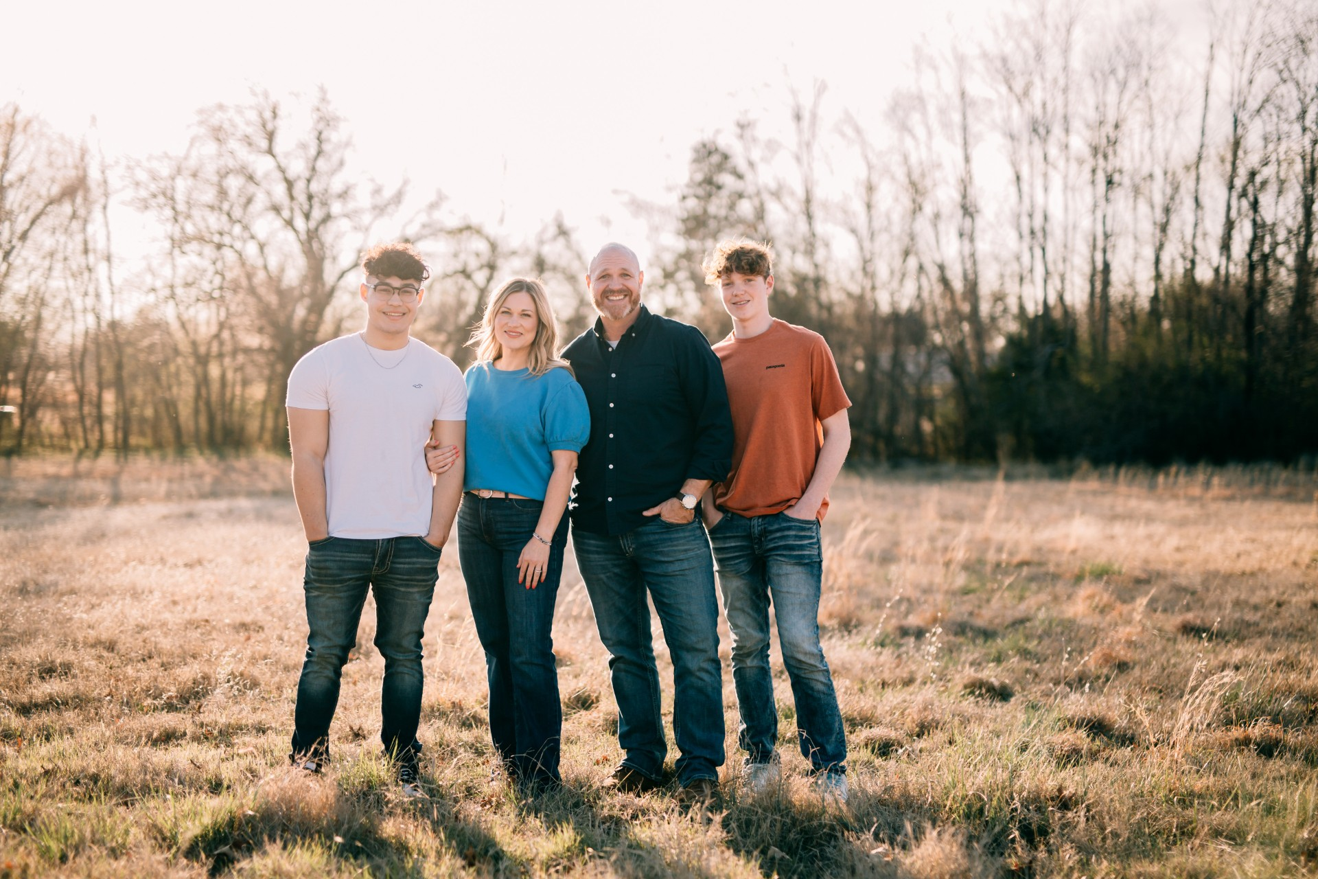 Image of the business owner's family standing in a field