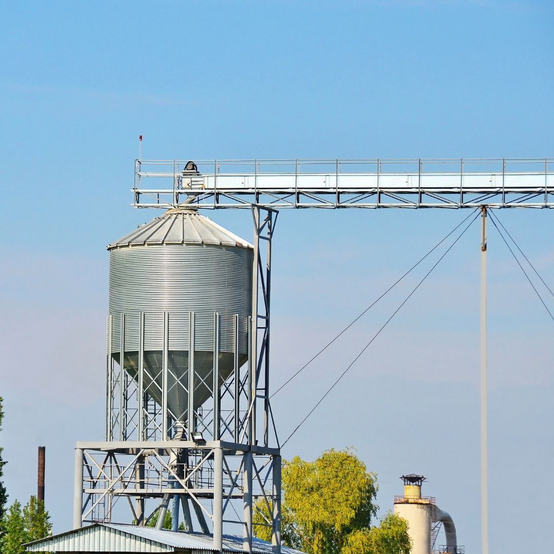 a grain dryer in a wheat field