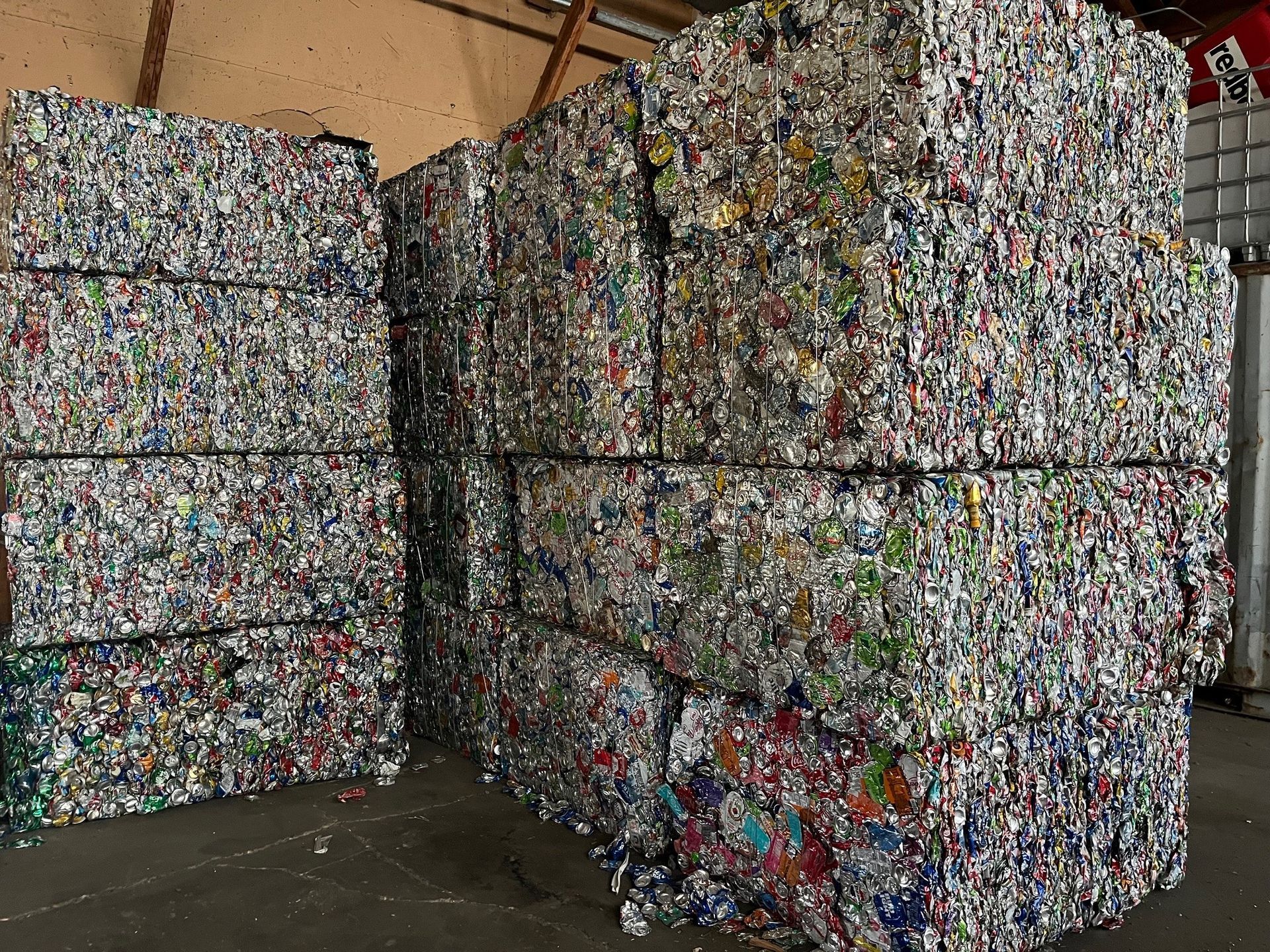 A pile of cans stacked on top of each other in a warehouse.