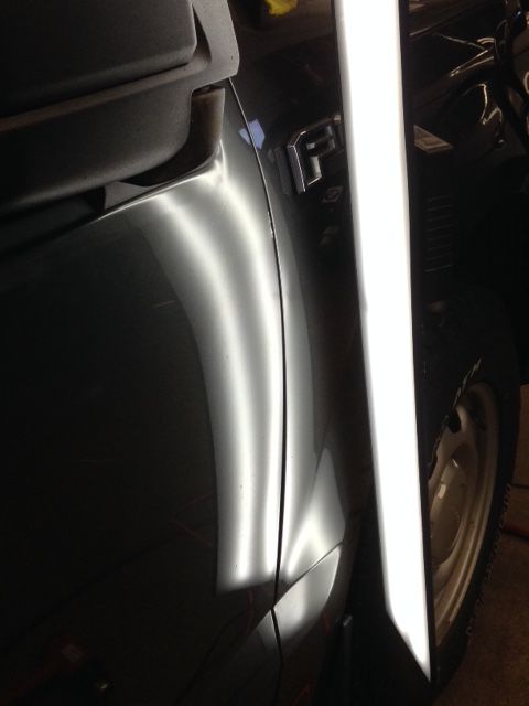 A close up of a car with a light shining on it