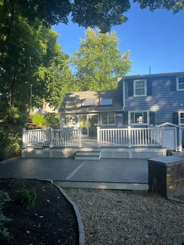 The back of a house with a large deck.