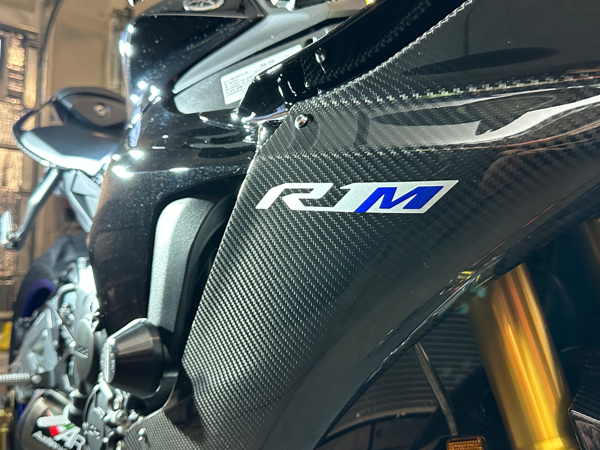 Black and carbon fiber motorcycle fairing with 
