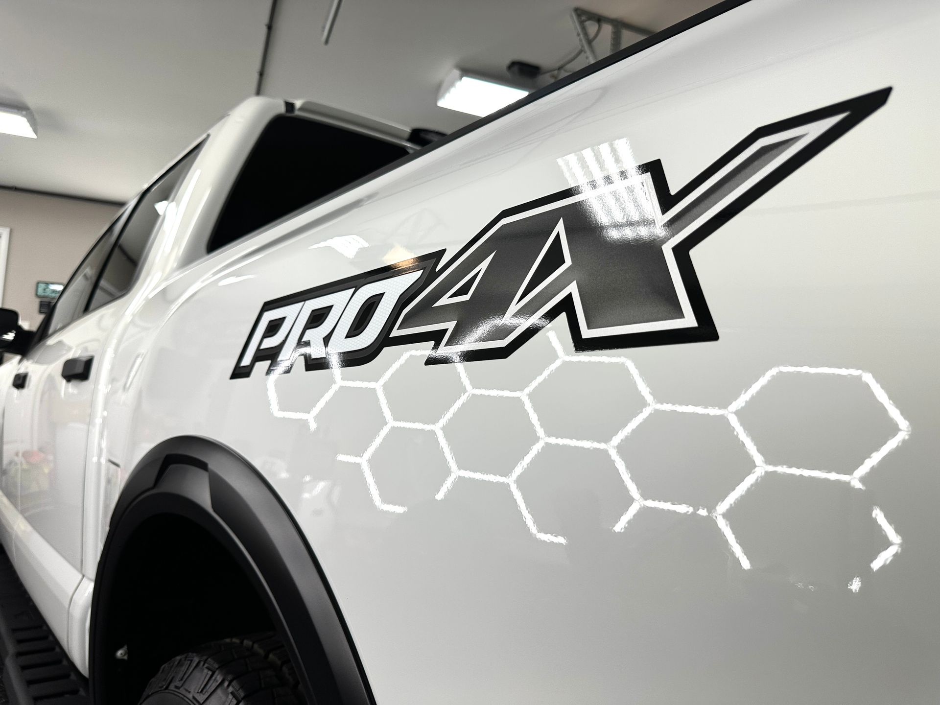 White pickup truck with a black and white 