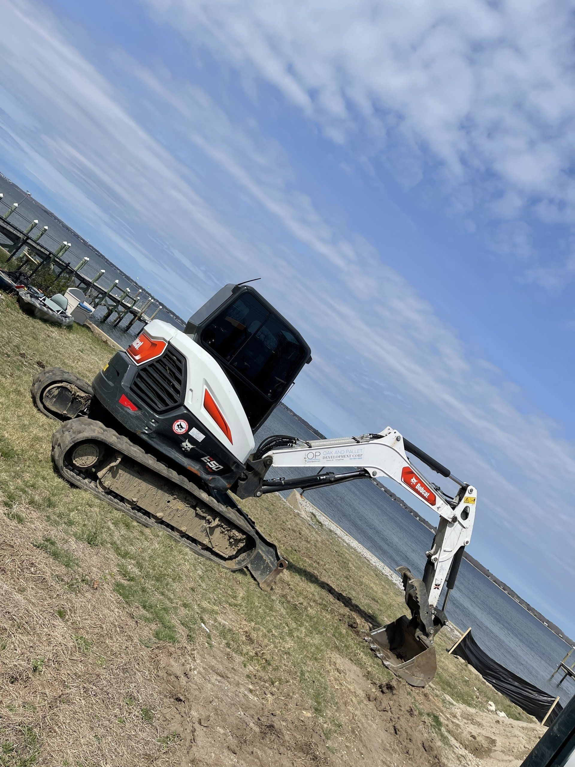Excavator near a lake