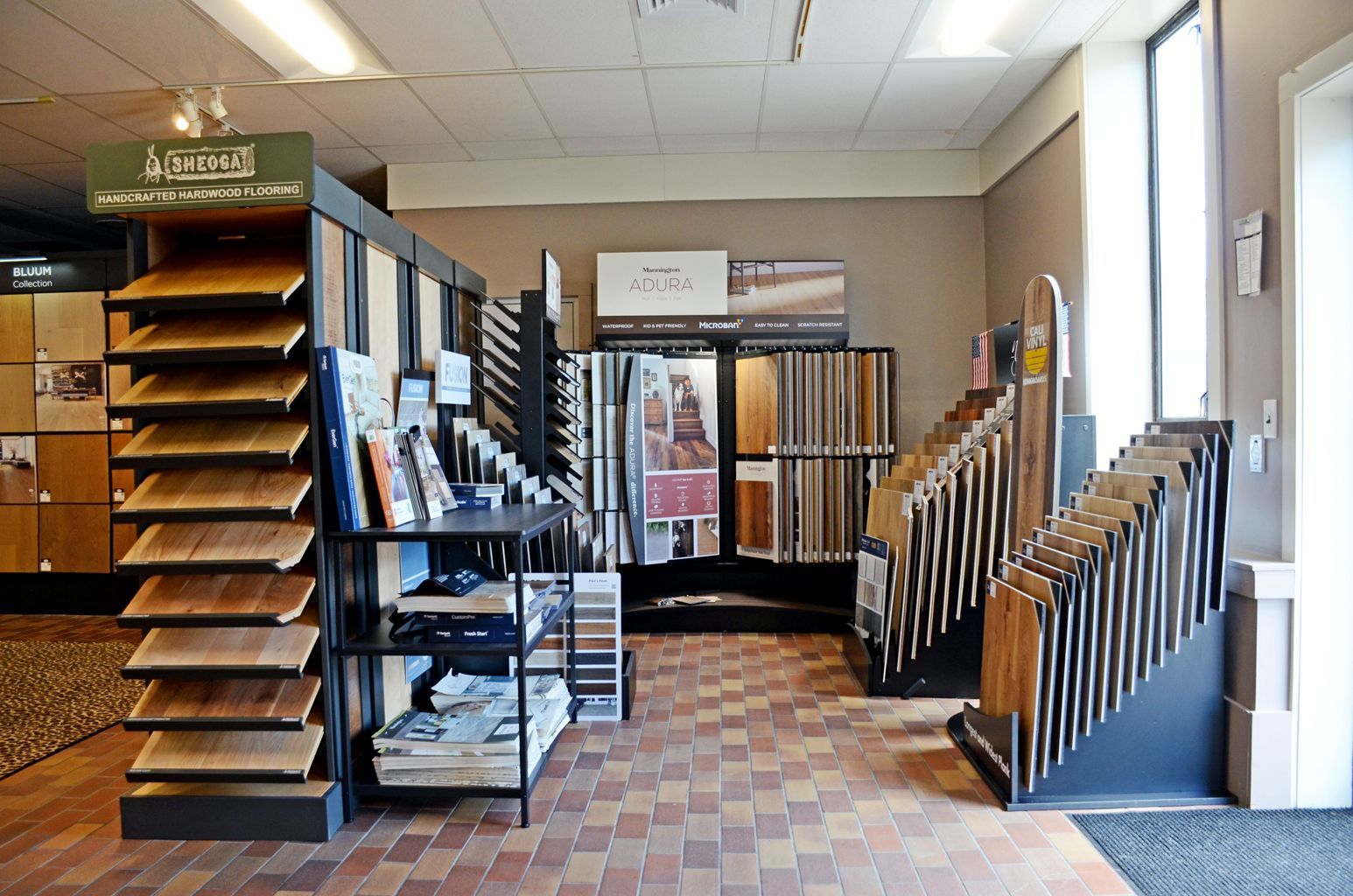 Flooring showroom with display racks and samples in a bright interior