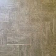 Gray stone floor tiles in a rectangular pattern.