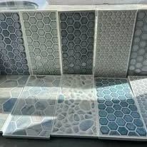 Various tiles, including honeycomb and stone patterns, in shades of blue and gray.
