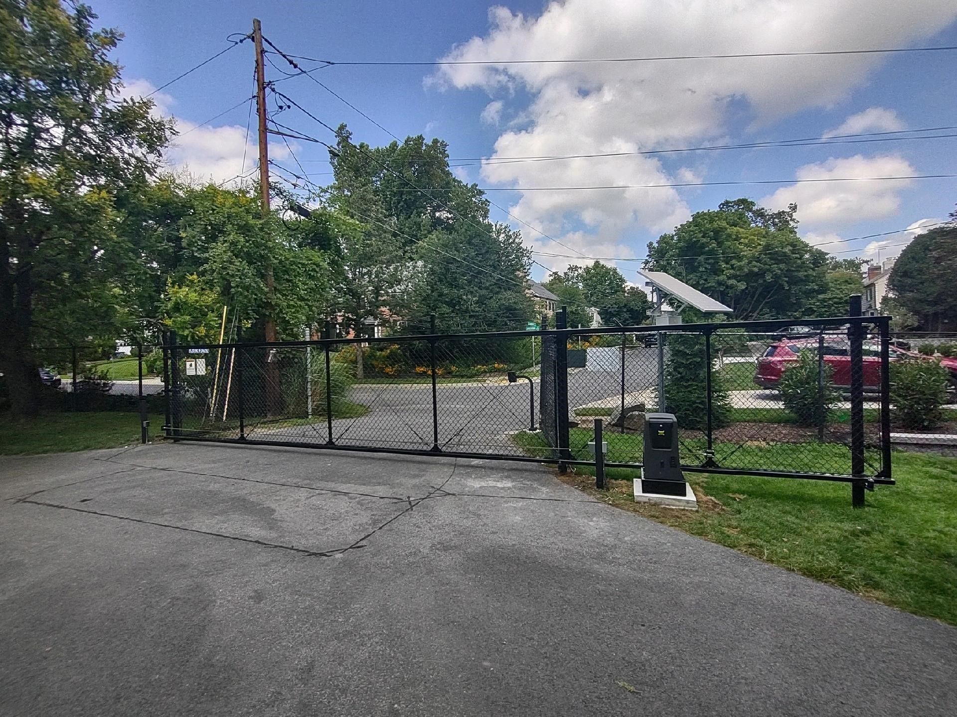 sliding gate closed across a vehicle entrance