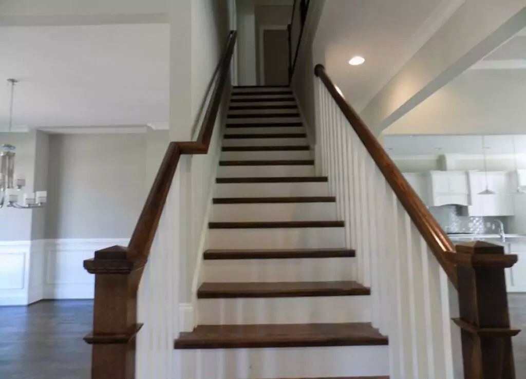 A set of stairs leading up to the second floor of a house