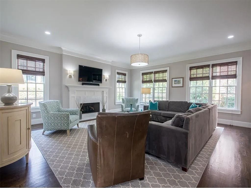 A living room filled with furniture and a fireplace.