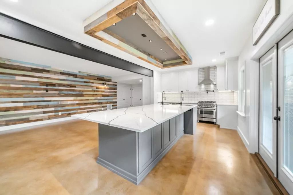 There is a large island in the middle of the kitchen.