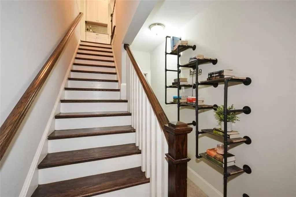 A set of stairs leading up to the second floor of a house.
