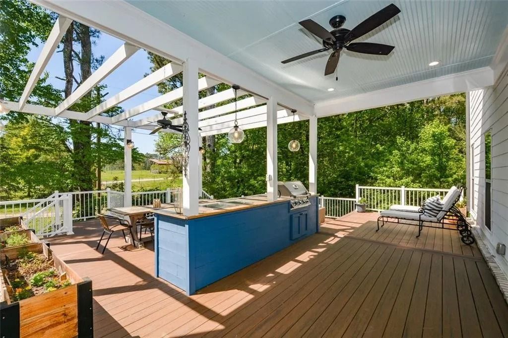 There is a ceiling fan on the roof of the deck.