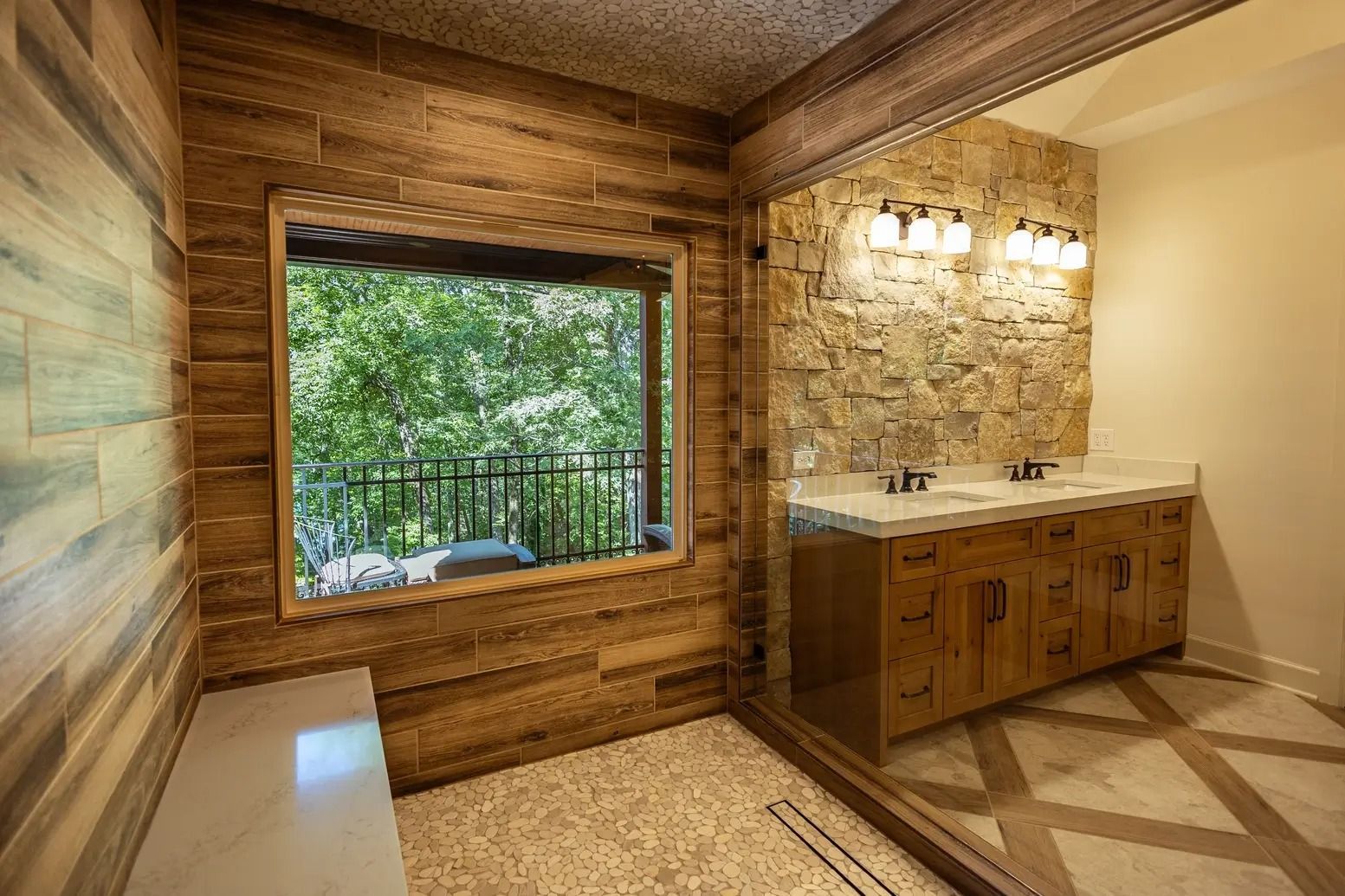A bathroom with two sinks and a large window.