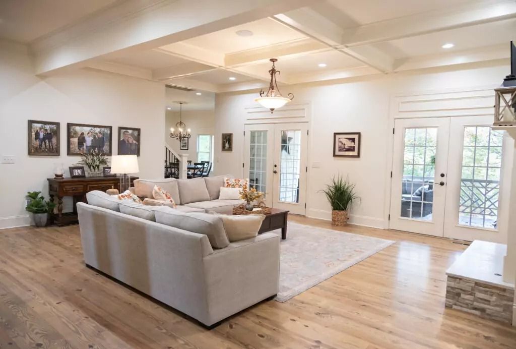 A living room filled with furniture and a fireplace.