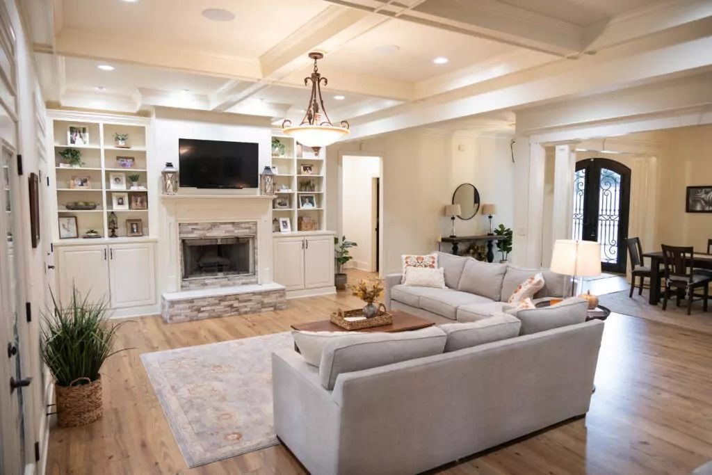 A living room filled with furniture and a fireplace.